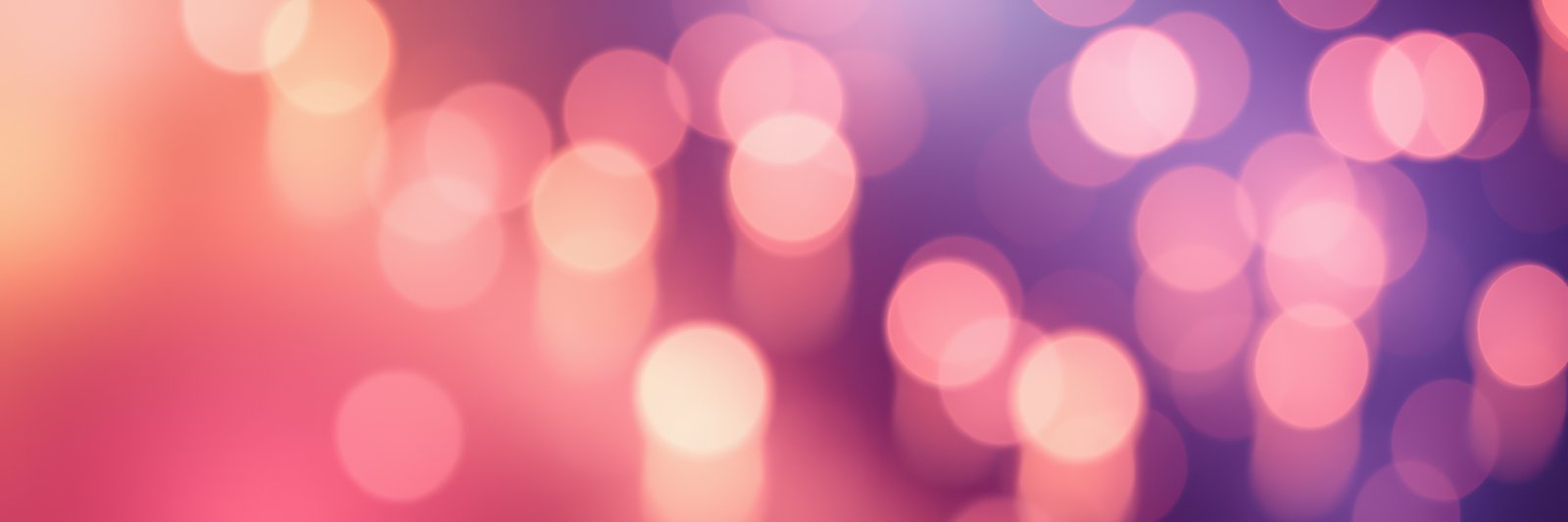 Pink and purple lights blur into a soft, colorful backdrop
